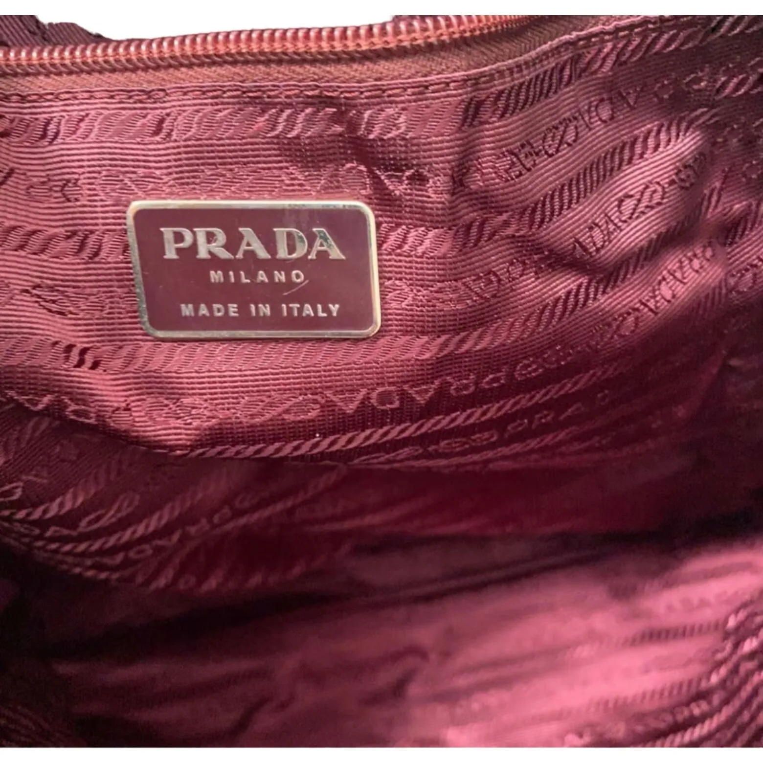 1990s Prada, dark red nylon & patent leather, satchel or tote bag with two handles, multiple compartments & pockets, & chrome hardware